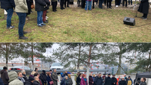 Gruppenfotos von der bezirklichen Gedenkveranstaltung zum 27. Januar beim Güterbahnhof Moabit. Einge Gruppe von ca. 100 Menschen steht in einem Halbkreis um eine Person, die eine Rede mit einem Mikrofon hält.